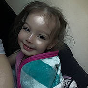 Elleigha is registered to the contest to win money with this photo: child, smiling, blanket, cozy, indoor, portrait, toddler, happy, wrapped, cute, face, hair, comfort, relaxing, young, person, warm, soft, seated, casual
