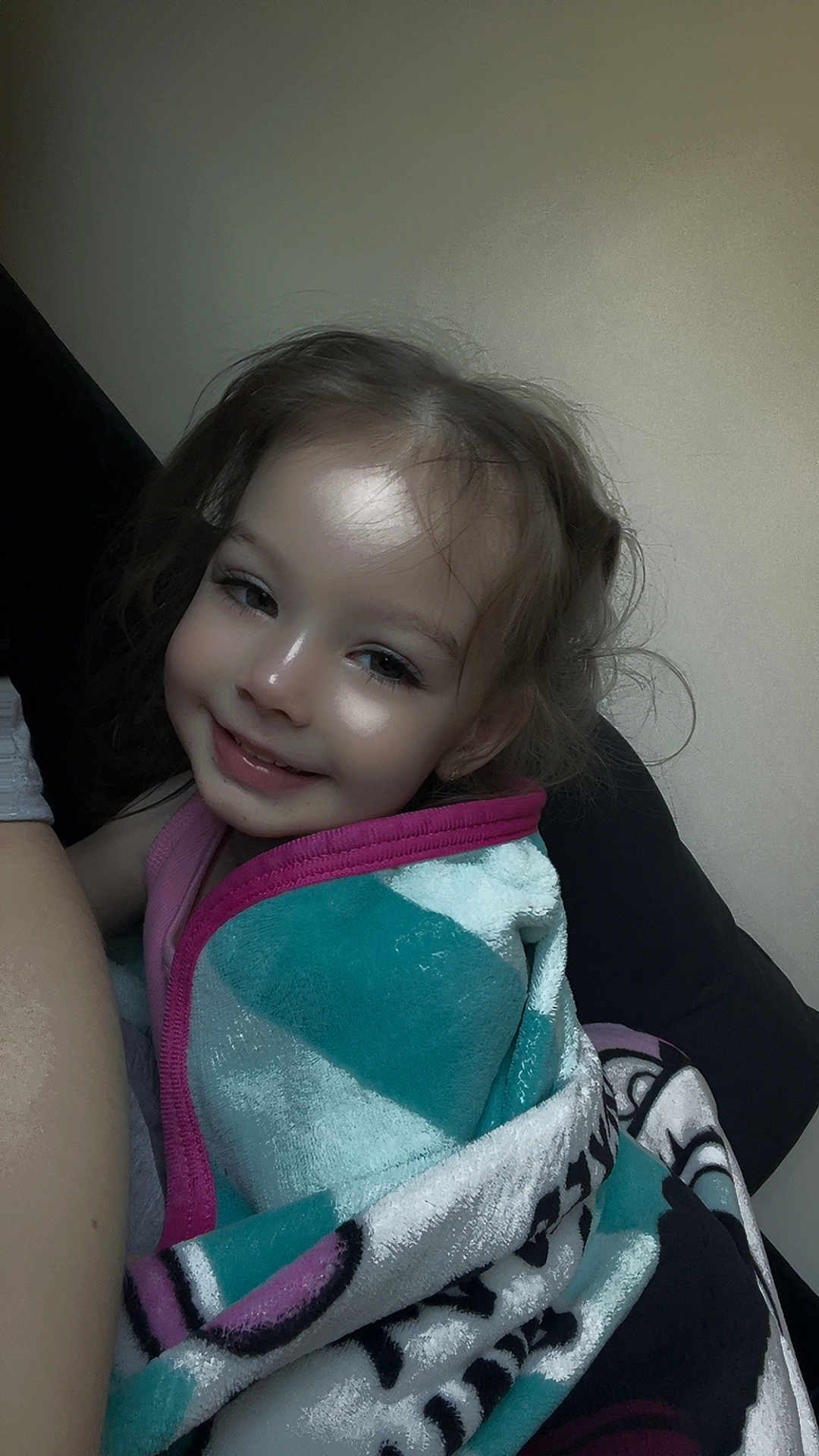 Elleigha is registered to the contest to win money with this photo: child, smiling, blanket, cozy, indoor, portrait, toddler, happy, wrapped, cute, face, hair, comfort, relaxing, young, person, warm, soft, seated, casual