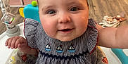 Emberlynn joined the competition — help win amazing prizes! baby, child, pigtails, smiling, indoor, baby_seat, animal_print, cute, happy, infant, clothing, furniture, flooring, storage, toy, person, face, portrait, home, wood_floor