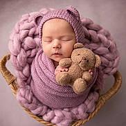 Sawyer joined the competition — help win amazing prizes! newborn, baby, sleeping, teddy_bear, knit_blanket, purple, basket, cozy, hat, cute, infant, wrapped, soft, child, portrait, peaceful, warm, plush, adorable, resting
