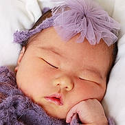 Amelia joined the competition — help win amazing prizes! baby, sleeping, newborn, purple_headband, purple_outfit, soft_blanket, closeup, peaceful, cute, infant, portrait, resting, child, face, hand, delicate, tulle, soft_texture, cozy, adorable