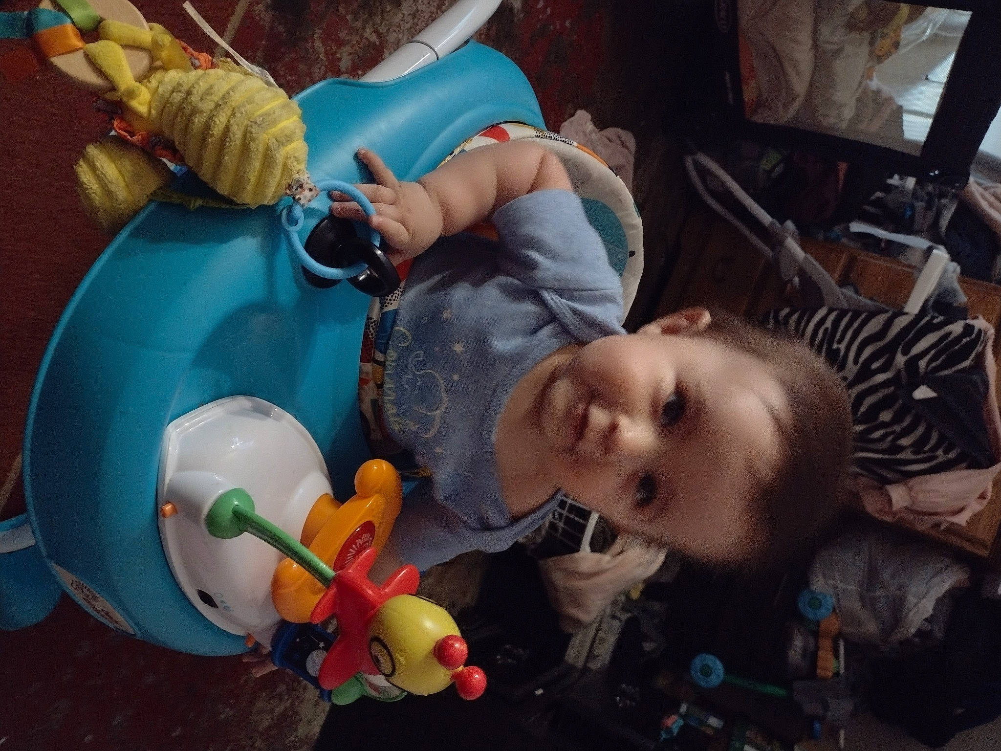 Omar is registered to the contest to win money with this photo: baby, baby_products, baby_toys, balloon, chair, cheek, child, fun, happy, mouth, party_supply, person, plastic, play, room, sitting, smile, toddler, toy, vacation