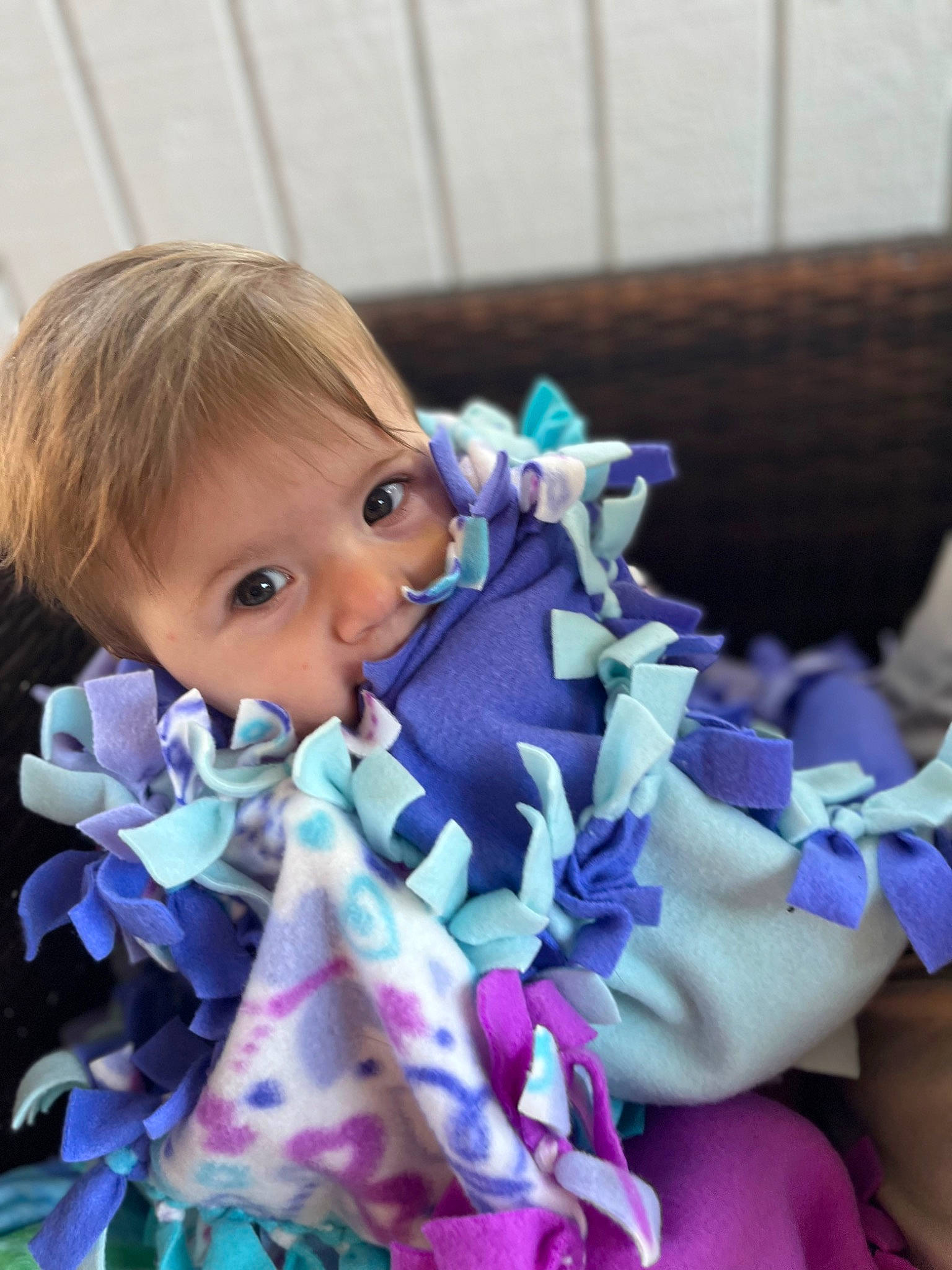 Taylyn is registered to the contest to win money with this photo: azure, baby_toddler_clothing, child, doll, electric_blue, eyelash, fashion_accessory, happy, headgear, iris, linens, magenta, pattern, person, petal, pink, purple, textile, toddler, toy