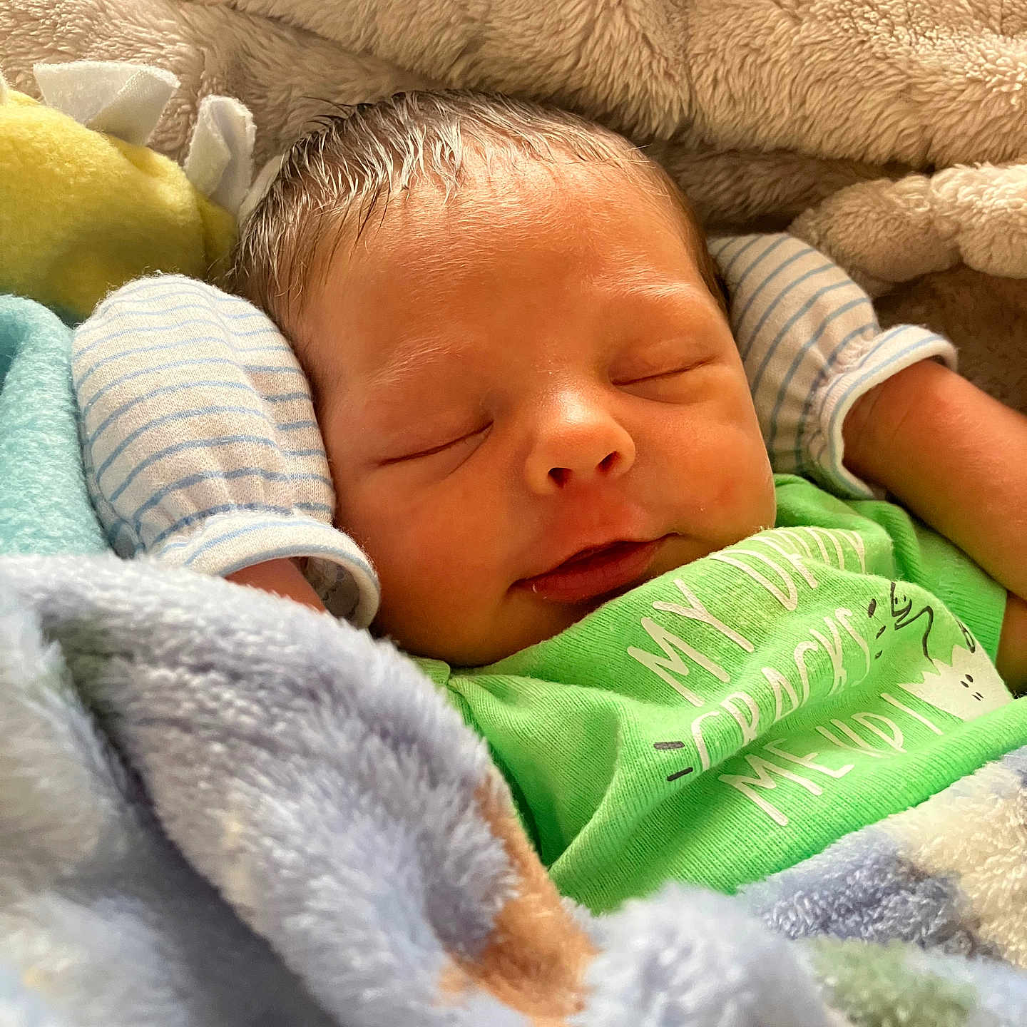 Dean joined the competition — help win amazing prizes! baby, blanket, child, closeup, cozy, cute, cute_baby, face, green_shirt, indoors, infant, mittens, newborn, peaceful, person, portrait, resting, sleeping, soft_texture, warm