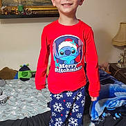 Peter joined the competition — help win amazing prizes! child, boy, smiling, pajamas, bed, blanket, lamp, painting, room, furniture, toy, red_clothing, blue_pants, snowflake_pattern, socks, smile, standing, indoors, person, home