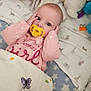 Elizabeth is registered to the contest to win money with this photo: baby, pacifier, crib, blanket, plush_toy, pink_clothing, face, infant, cute, sleeping_area, soft_toys, child, comfort, star_pattern, animal_print, yellow_pacifier, head, hands, closeup, resting