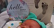 Astrid joined the competition — help win amazing prizes! newborn, baby, pacifier, headband, hospital, bassinet, blanket, footprints, birth_card, sleeping, infant, cute, resting, baby_clothes, hospital_room, celebration, portrait, child, peaceful, indoors