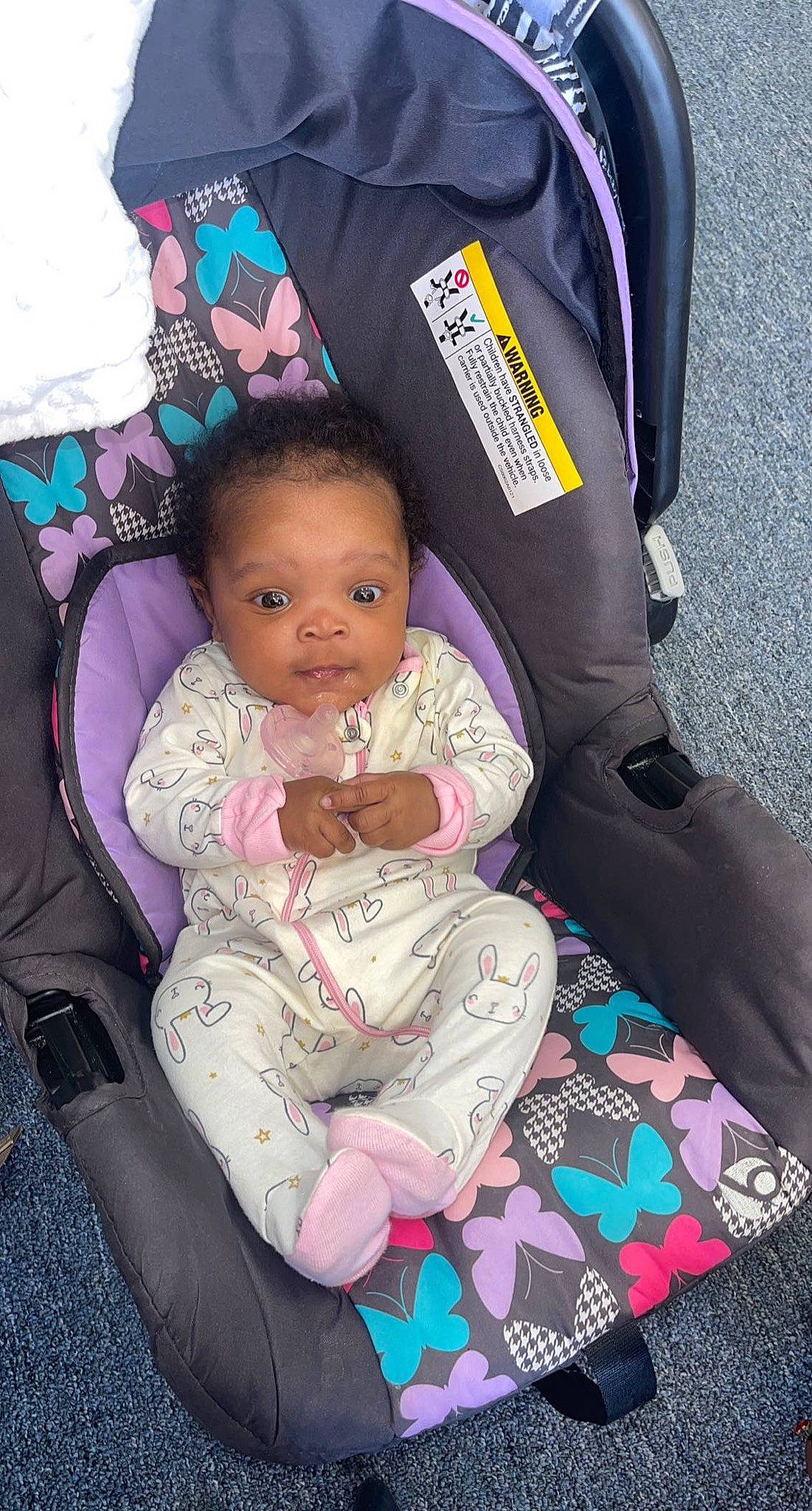 Lani joined the competition — help win amazing prizes! baby, baby_carriage, baby_products, baby_toddler_clothing, bag, car_seat, carmine, cheek, child, comfort, hairstyle, lap, luggage_and_bags, magenta, person, pink, purple, sitting, toddler, travel