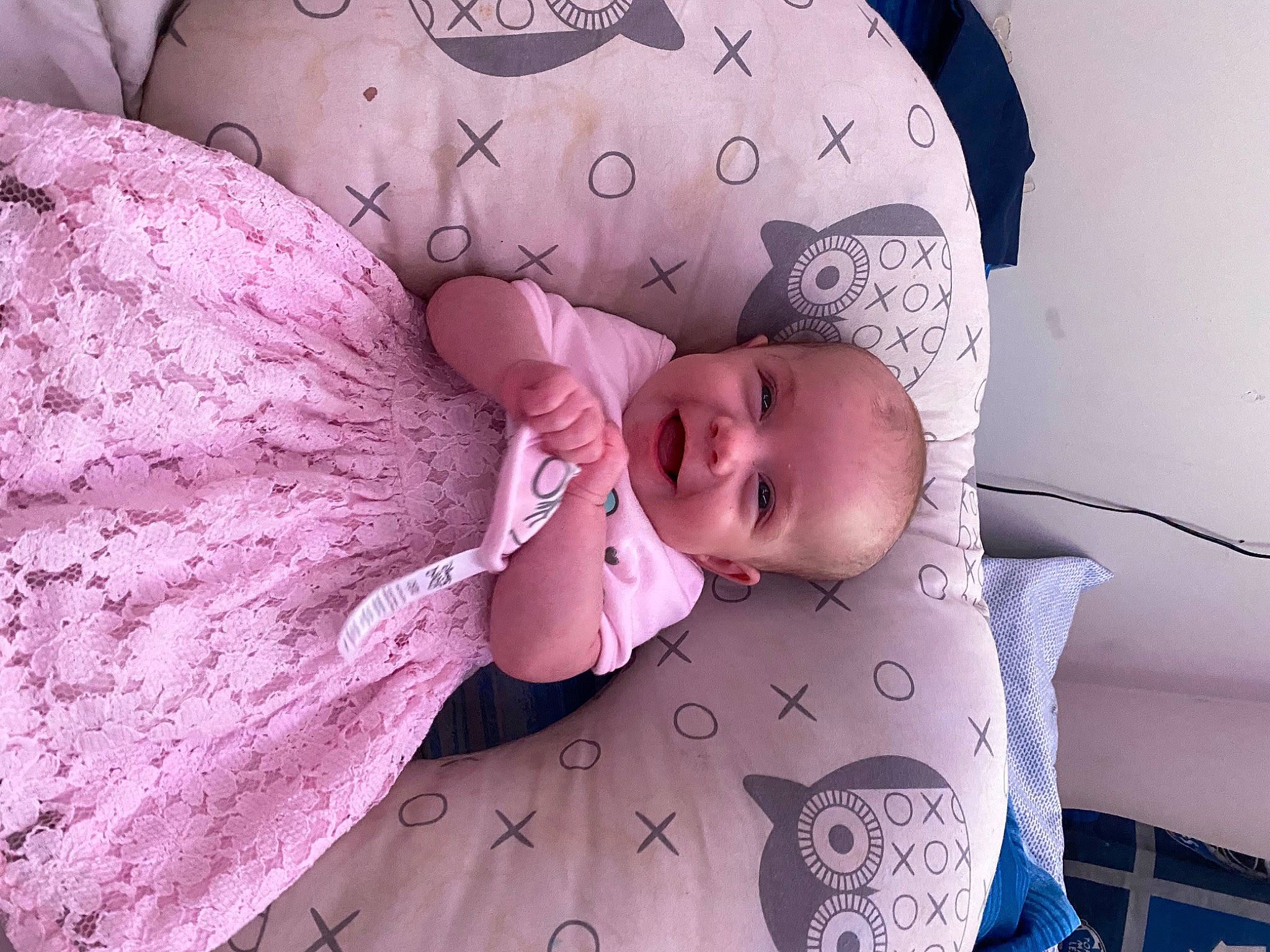 Brealynn is registered to the contest to win money with this photo: arm, baby, baby_products, baby_sleeping, baby_toddler_clothing, bedding, child, comfort, couch, hand, linens, magenta, pattern, person, pink, purple, skin, sleeve, textile, toddler