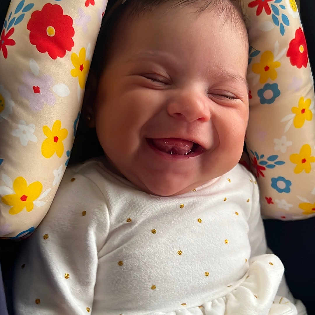 Analia Sucre joined the competition — help win amazing prizes! adorable, baby, baby_girl, cheerful, child, closeup, cushion, cute, floral_pattern, flower_headband, happy, headband, indoors, infant, polka_dots, portrait, seat, smiling, white_clothing, young_child