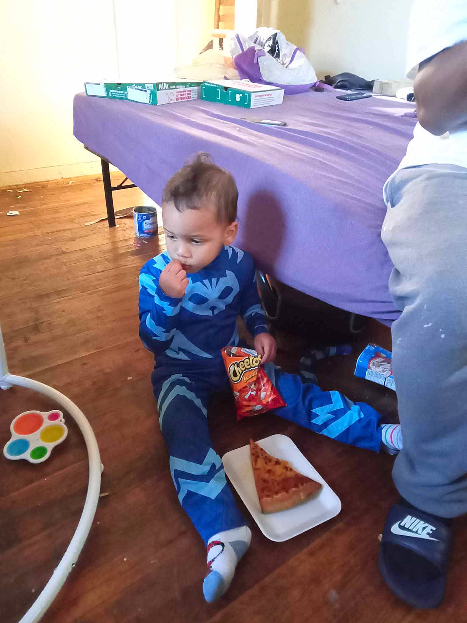 Jamir is registered to the contest to win money with this photo: baby, baby_toddler_clothing, child, comfort, flooring, food, fun, hardwood, leisure, person, play, room, sharing, sitting, sneakers, t_shirt, toddler, varnish, wood, wood_flooring