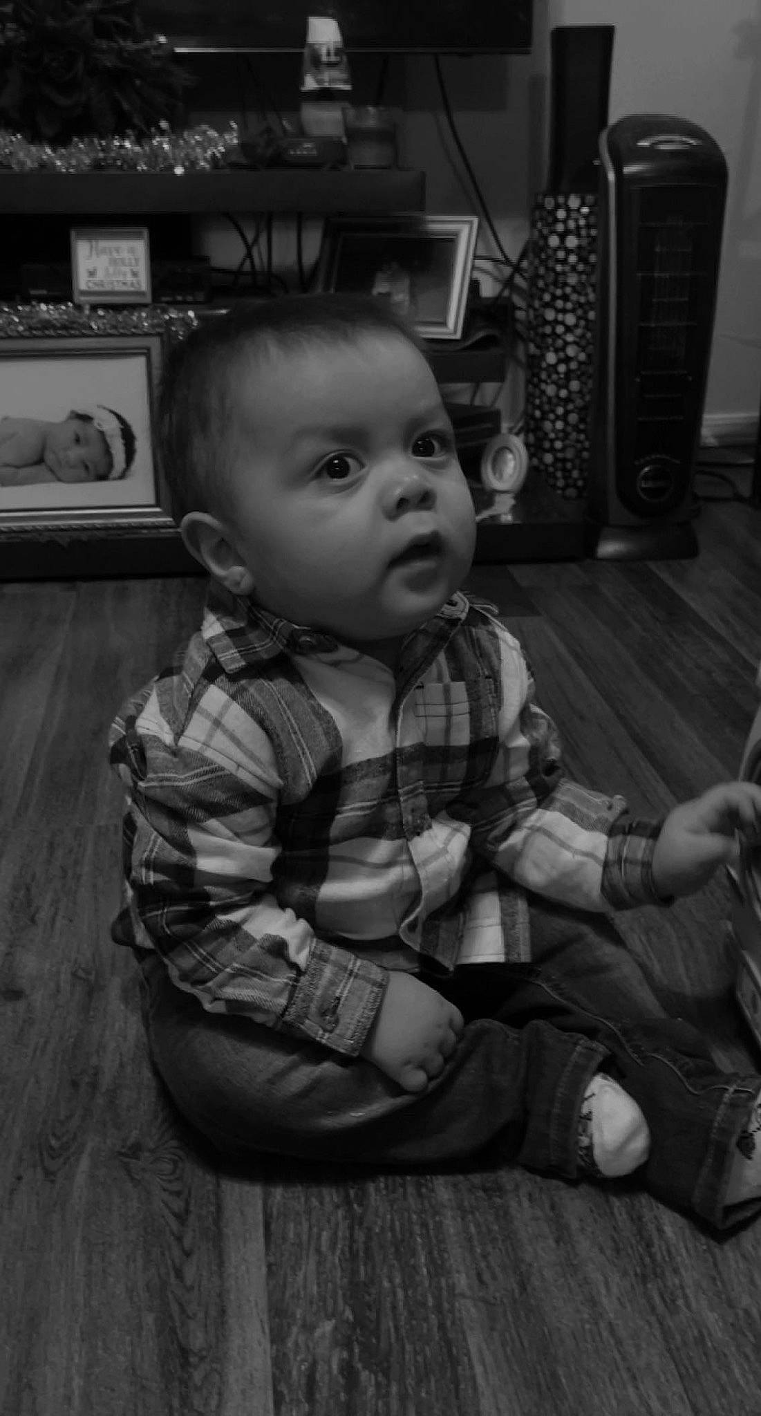 Eslan is registered to the contest to win money with this photo: baby, baby_toddler_clothing, black, black_and_white, cheek, child, flooring, fun, happy, home_appliance, human_body, monochrome, monochrome_photography, person, play, room, sitting, standing, style, toddler