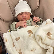 Asad joined the competition — help win amazing prizes! baby, sleeping, blanket, hat, infant, cushion, seat, cozy, cute, child, soft, warm, clothing, resting, indoors, person, small, peaceful, wrapped, newborn