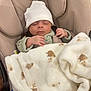 baby, sleeping, blanket, hat, infant, cushion, seat, cozy, cute, child, soft, warm, clothing, resting, indoors, person, small, peaceful, wrapped, newborn