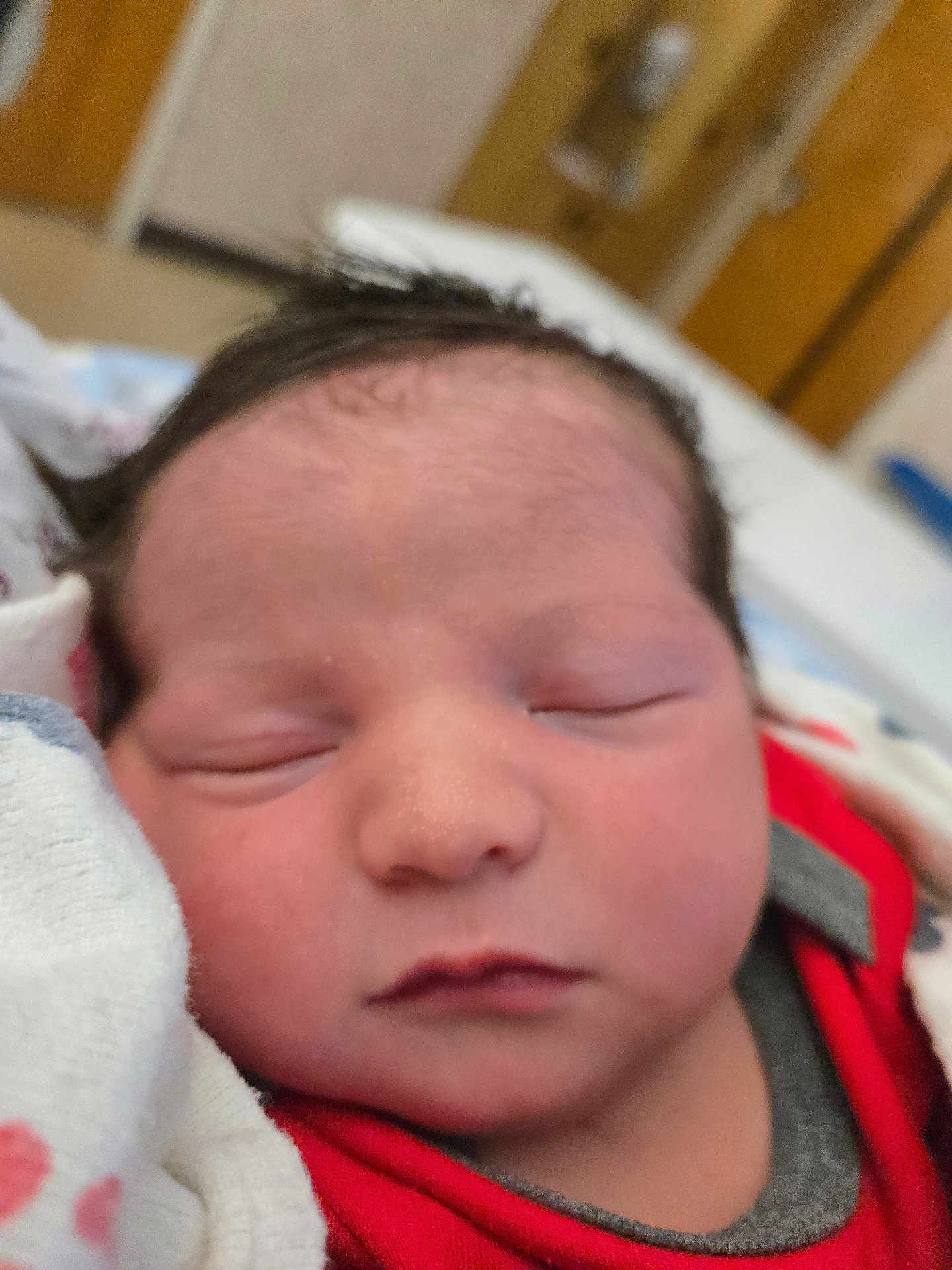 Joel is registered to the contest to win money with this photo: newborn, baby, sleeping, close_up, infant, face, blanket, indoors, peaceful, soft, skin, head, cute, child, portrait, young, resting, cozy, clothing, newborn_baby