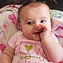 Harper is registered to the contest to win money with this photo: baby, infant, child, pigtails, pink_clothing, blanket, smiling, thumb_in_mouth, cute, face, portrait, sitting, indoors, cozy, soft_texture, happy, young_child, closeup, adorable, glitter