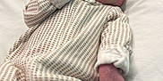 Karsyn is registered to the contest to win money with this photo: baby, blanket, child, closeup, cute, face, hand, human, indoors, infant, newborn, onesie, patterned_clothing, peaceful, portrait, resting, skin, sleeping, soft, young_child