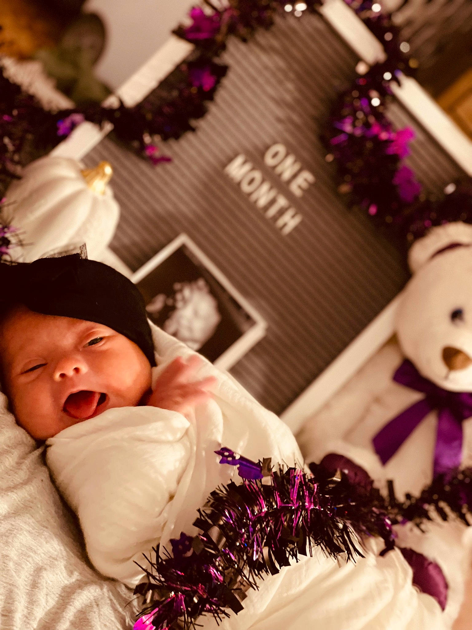 Ella Joy joined the competition — help win amazing prizes! baby, child, event, fashion, fashion_accessory, flower_arranging, happy, headpiece, jewellery, linens, magenta, person, petal, pink, plant, purple, textile, toddler, toy, tradition