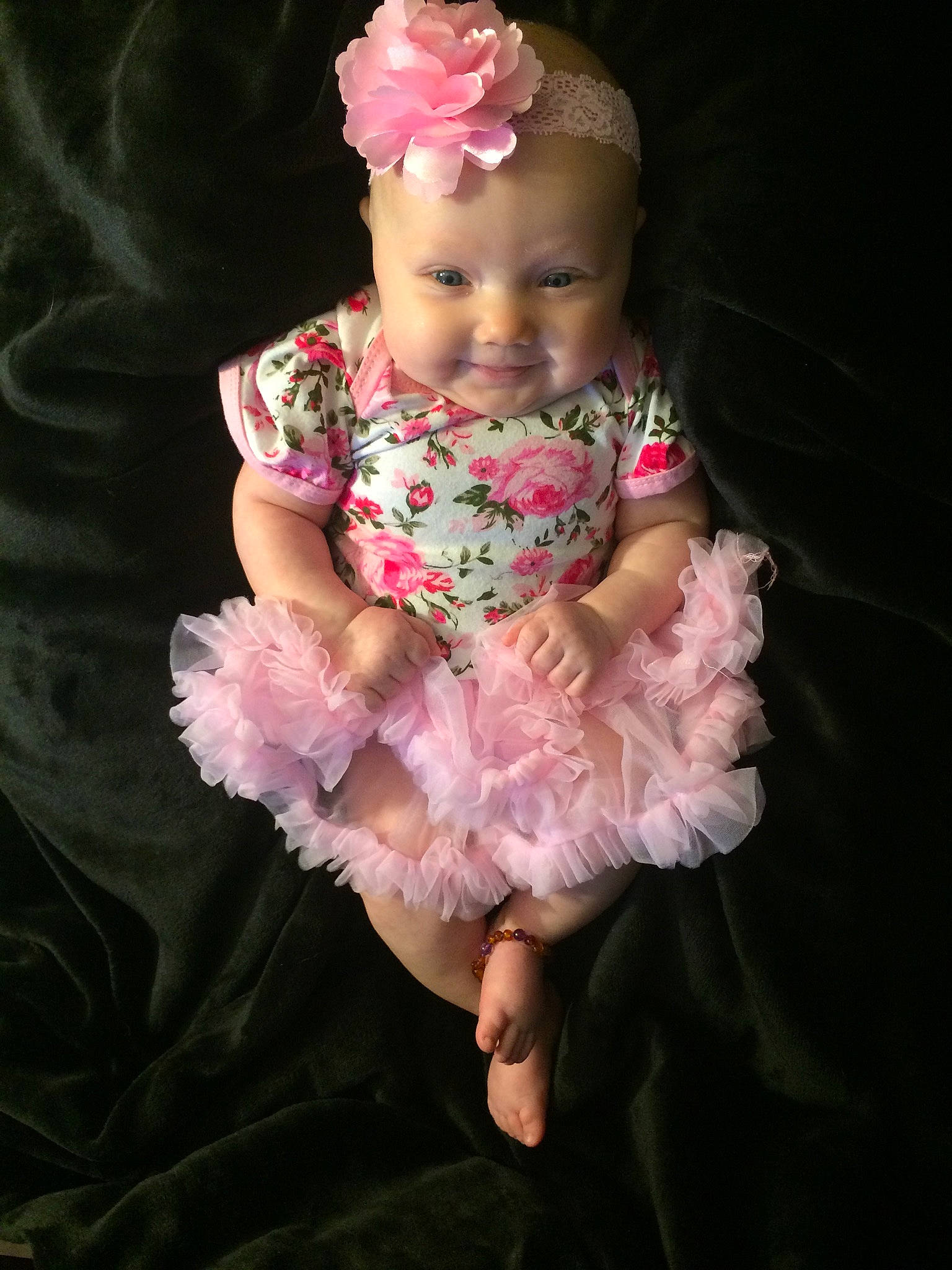 Stevie is registered to the contest to win money with this photo: baby, baby_products, baby_toddler_clothing, child, costume, dress, face, fashion_accessory, flower, hair_accessory, head, headgear, headpiece, joy, person, petal, pink, plant, product, skin