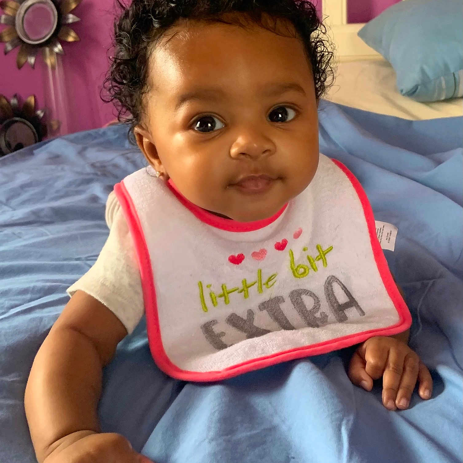 Aaliyah joined the competition — help win amazing prizes! baby, babylaughing, bed, bedroom, bib, clothing, cushion, face, furniture, hair, happy, head, homedecor, indoors, person, photography, portrait, room, sitting, sleeve