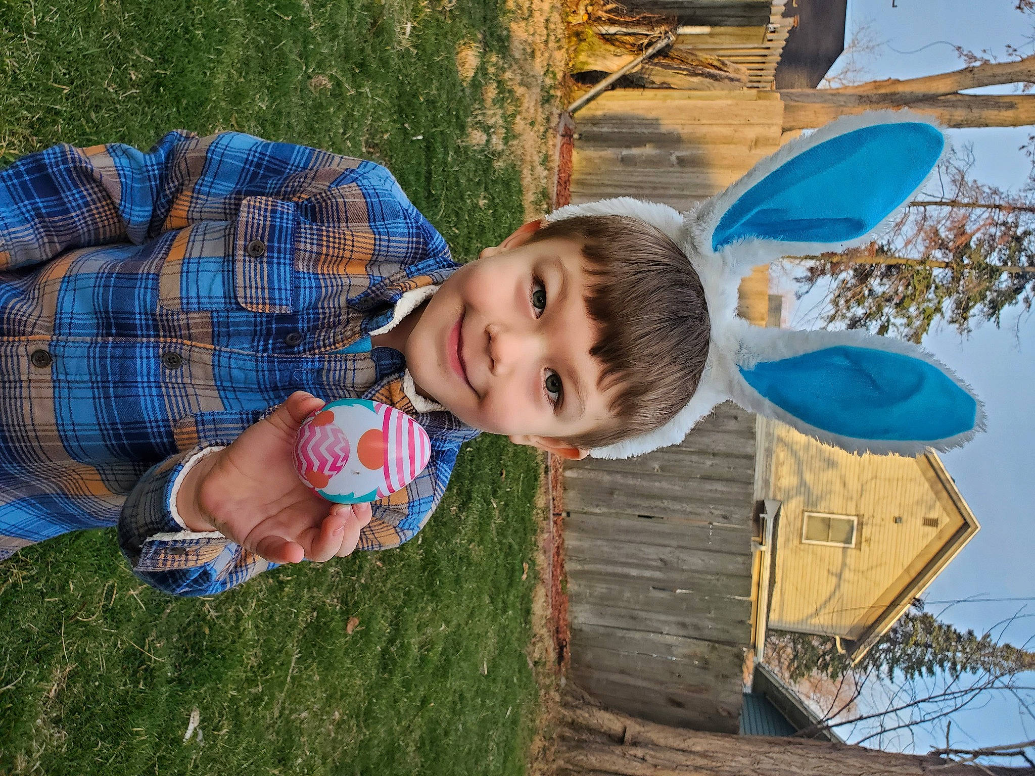 Ryker is registered to the contest to win money with this photo: azure, baby_toddler_clothing, child, electric_blue, fun, grass, happy, joy, leisure, people_in_nature, person, plant, recreation, sitting, smile, summer, t_shirt, toddler, tree, vacation