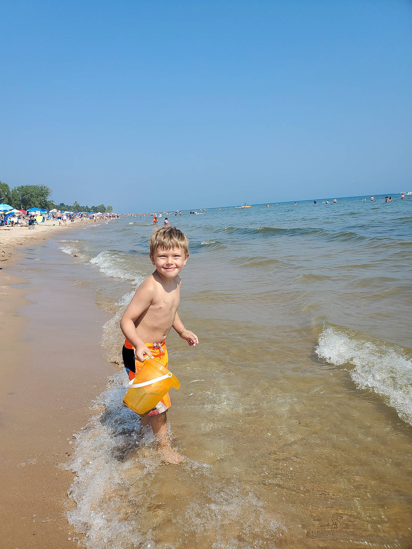 Ryker joined the competition — help win amazing prizes! back, beach, bodypart, boy, child, clothing, coast, face, head, male, nature, outdoors, person, photography, portrait, sea, shoreline, shorts, summer, water