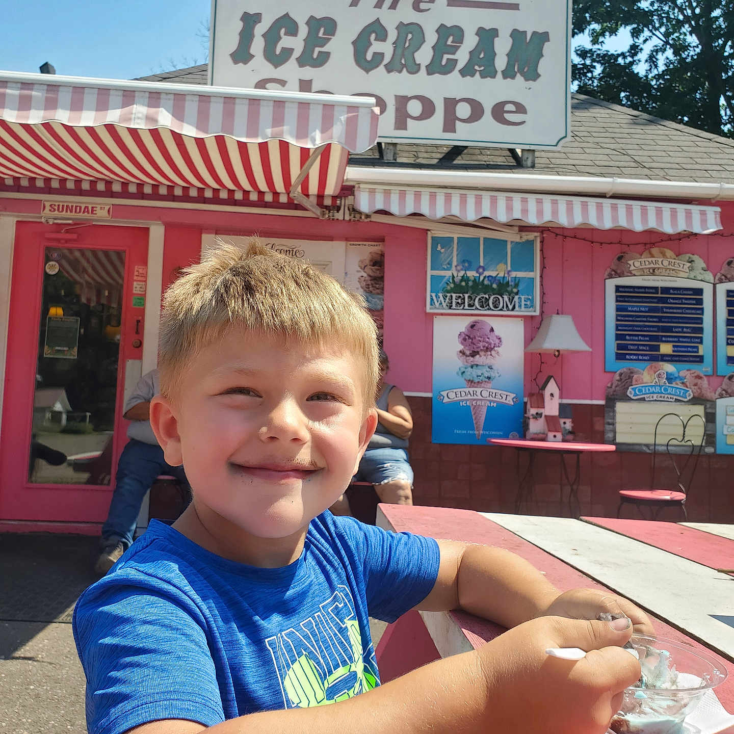 Ryker is registered to the contest to win money with this photo: architecture, building, clothing, cream, desk, dessert, diner, face, food, furniture, head, icecream, indoors, outdoors, person, photography, portrait, restaurant, shelter, t_shirt