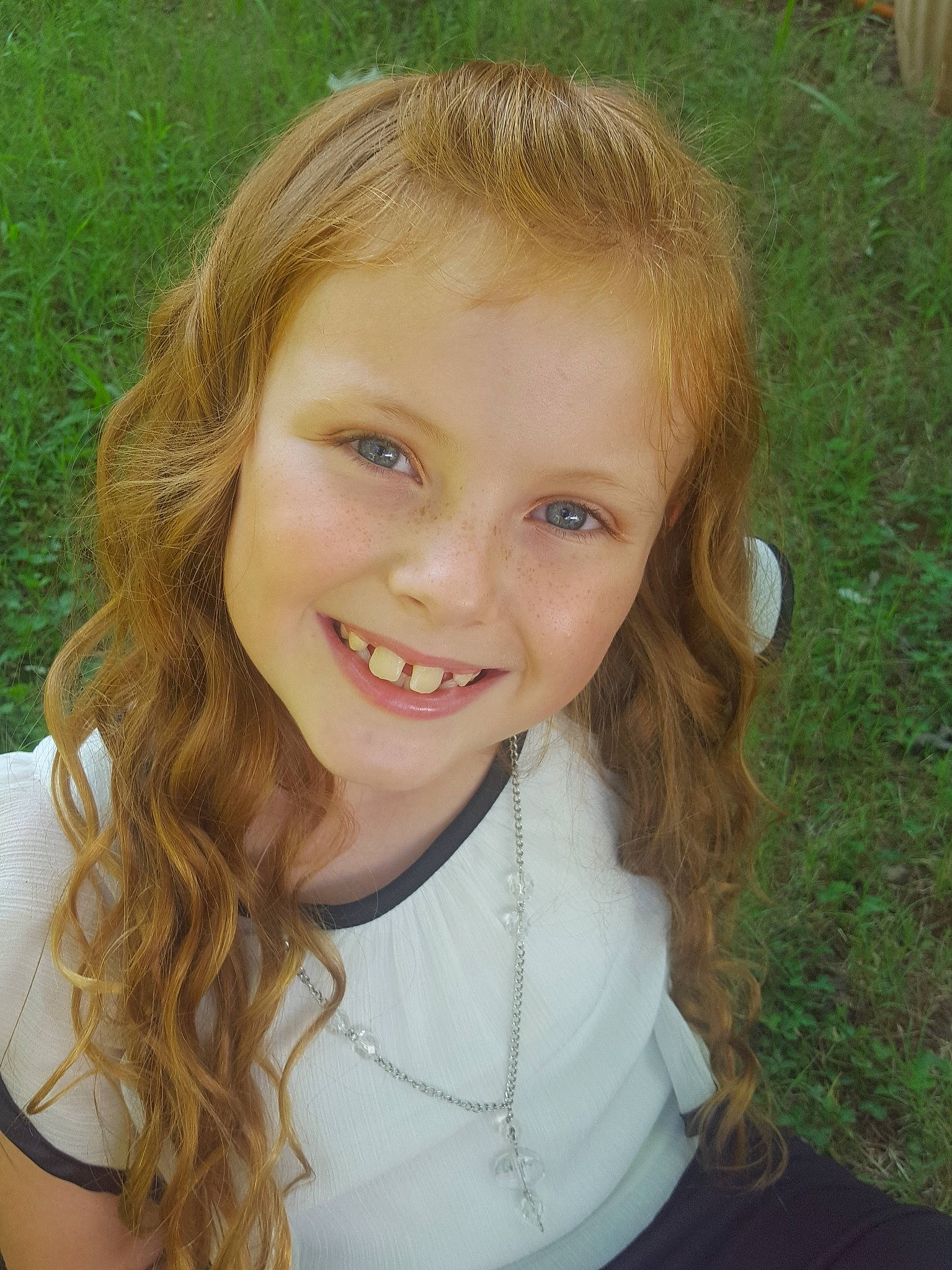 Savannah joined the competition — help win amazing prizes! beauty, blond, brown_hair, cheek, child, child_model, chin, eye, eyebrow, face, facial_expression, forehead, grass, hair, hairstyle, head, joy, lip, nose, person