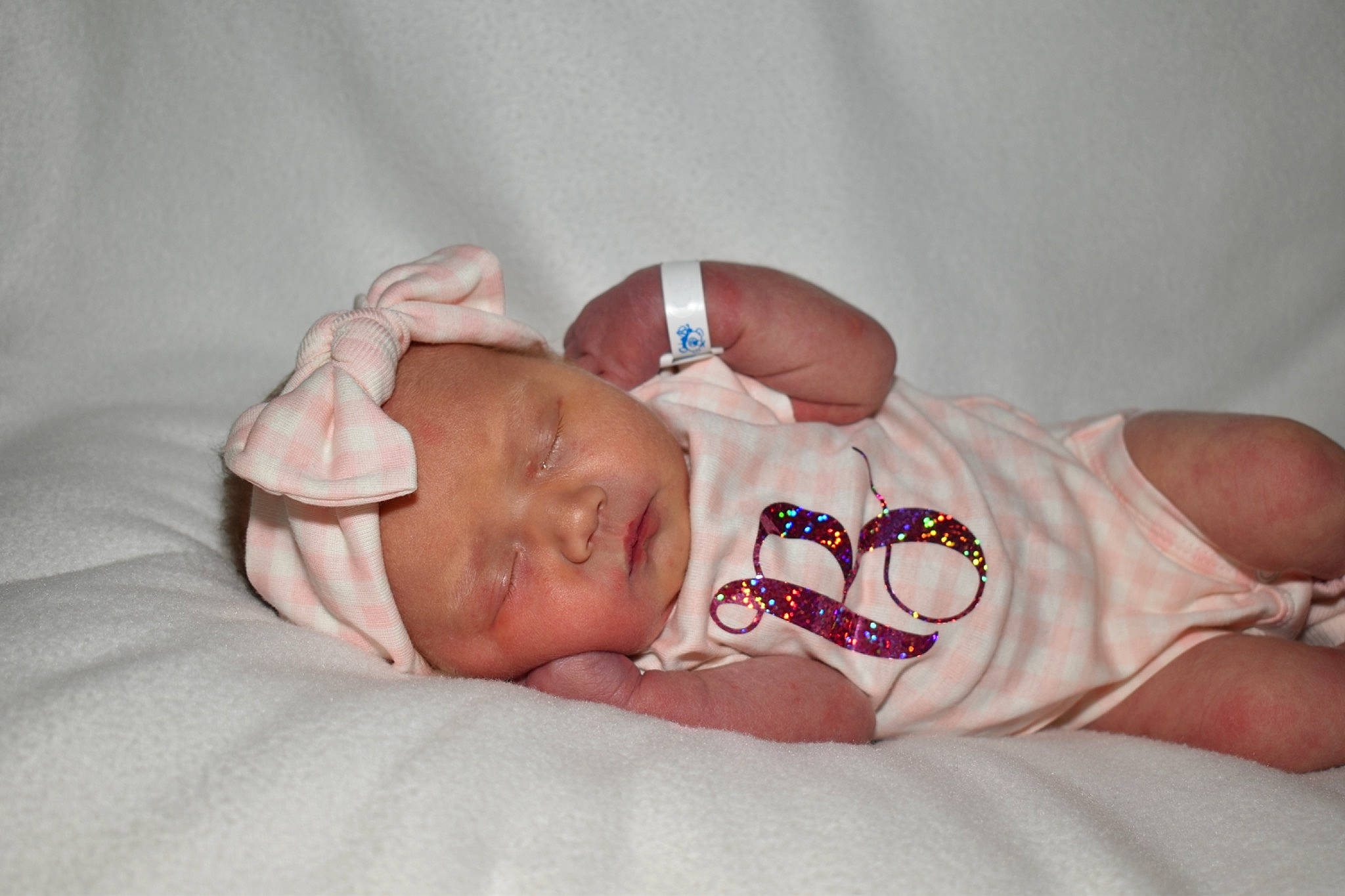 Brylee joined the competition — help win amazing prizes! abdomen, baby, baby_products, baby_sleeping, baby_toddler_clothing, comfort, finger, foot, glasses, headgear, headwear, human_body, knee, leg, linens, neck, person, skin, stomach, sunglasses