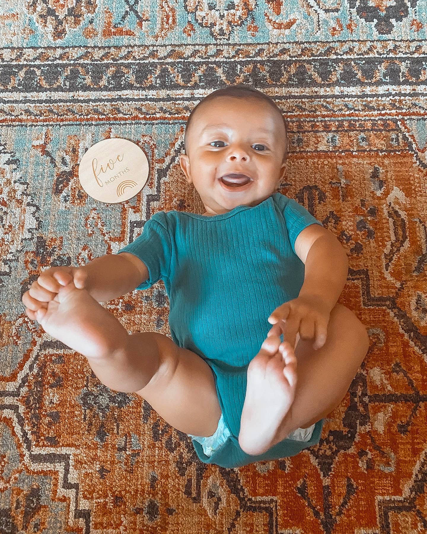 Lux is registered to the contest to win money with this photo: aqua, azure, baby, baby_toddler_clothing, eye, face, flash_photography, floor, flooring, happy, head, pattern, person, pink, smile, textile, thigh, toddler, trunk, wall