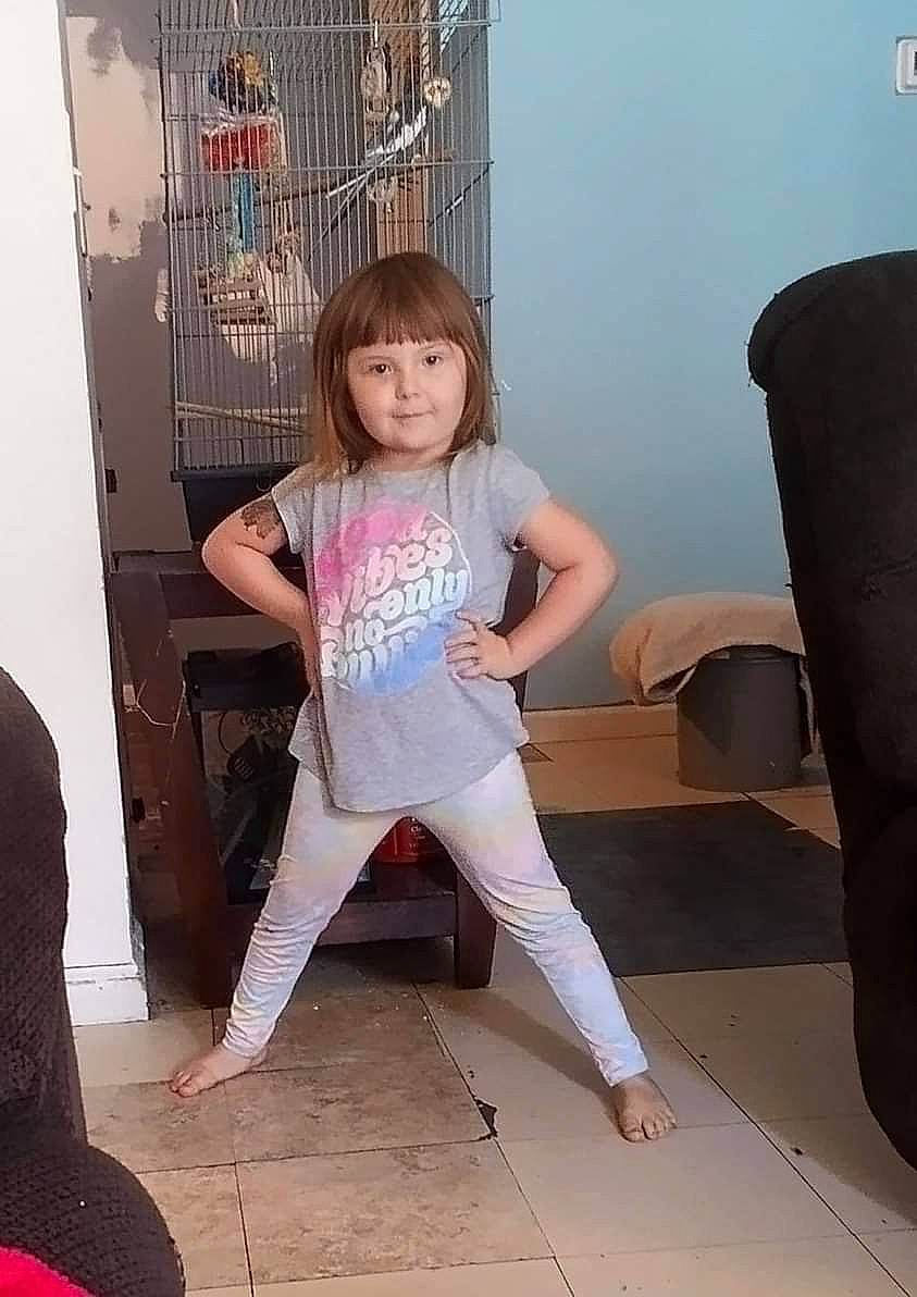 Ava is registered to the contest to win money with this photo: barefoot, black_hair, fashion_design, flooring, foot, fun, happy, human_leg, joint, knee, leg, long_hair, magenta, person, pink, shoulder, sitting, sleeve, thigh, waist