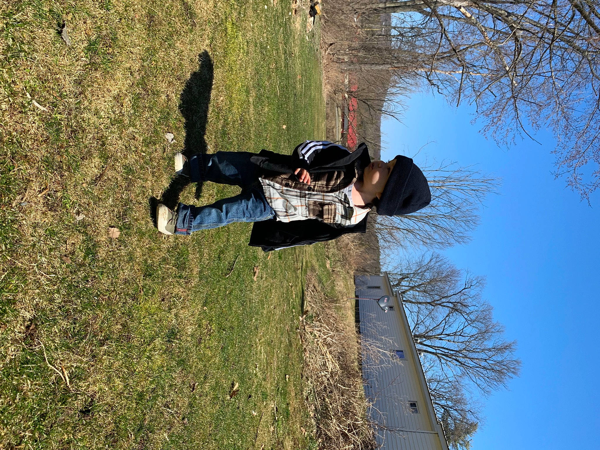 Ozias joined the competition — help win amazing prizes! adventure, branch, extreme_sport, fun, grass, headwear, leisure, outdoor_shoe, people_in_nature, person, plant, recreation, shadow, sky, soil, spring, tree, trunk, twig, walking_shoe