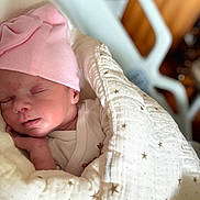 Lily Rose participe au concours pour gagner de l'argent avec cette photo : newborn, baby, sleeping, blanket, pink_hat, infant, cozy, face, hand, soft, cute, portrait, indoors, resting, peaceful, child, wrapped, star_pattern, clothing, closeup