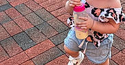 Shylah joined the competition — help win amazing prizes! baby, bottle, brick_pavement, child, curly_hair, cute, daylight, fun, happy, joyful, outdoor, person, pink_lid, playful, shorts, smiling, summer_clothing, toddler, walking, white_shoes
