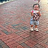 Shylah is registered to the contest to win money with this photo: baby_bottle, brick, casual_clothing, child, curly_hair, daytime, group, happy, outdoor, pavement, people, playful, railing, sidewalk, smiling, sunlight, toddler, urban, walking, water_bottle