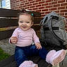 Shylah joined the competition — help win amazing prizes! backpack, bench, blue_jeans, brick_wall, casual, child, concrete, daylight, grass, hair_clips, happy, outdoor, person, pink_boots, pink_clothing, sidewalk, sitting, smiling, toddler, window