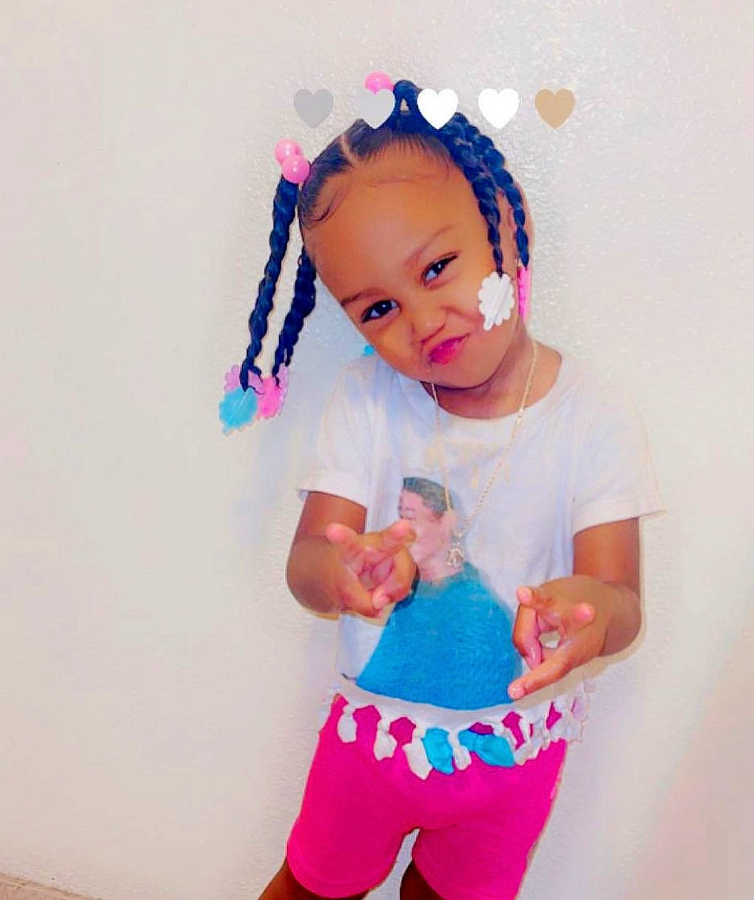 Kahmya is registered to the contest to win money with this photo: aqua, baby, baby_toddler_clothing, clothing, cool, eye, eyelash, face, gesture, hair, happy, headgear, neck, outerwear, person, pink, purple, shoulder, sleeve, standing