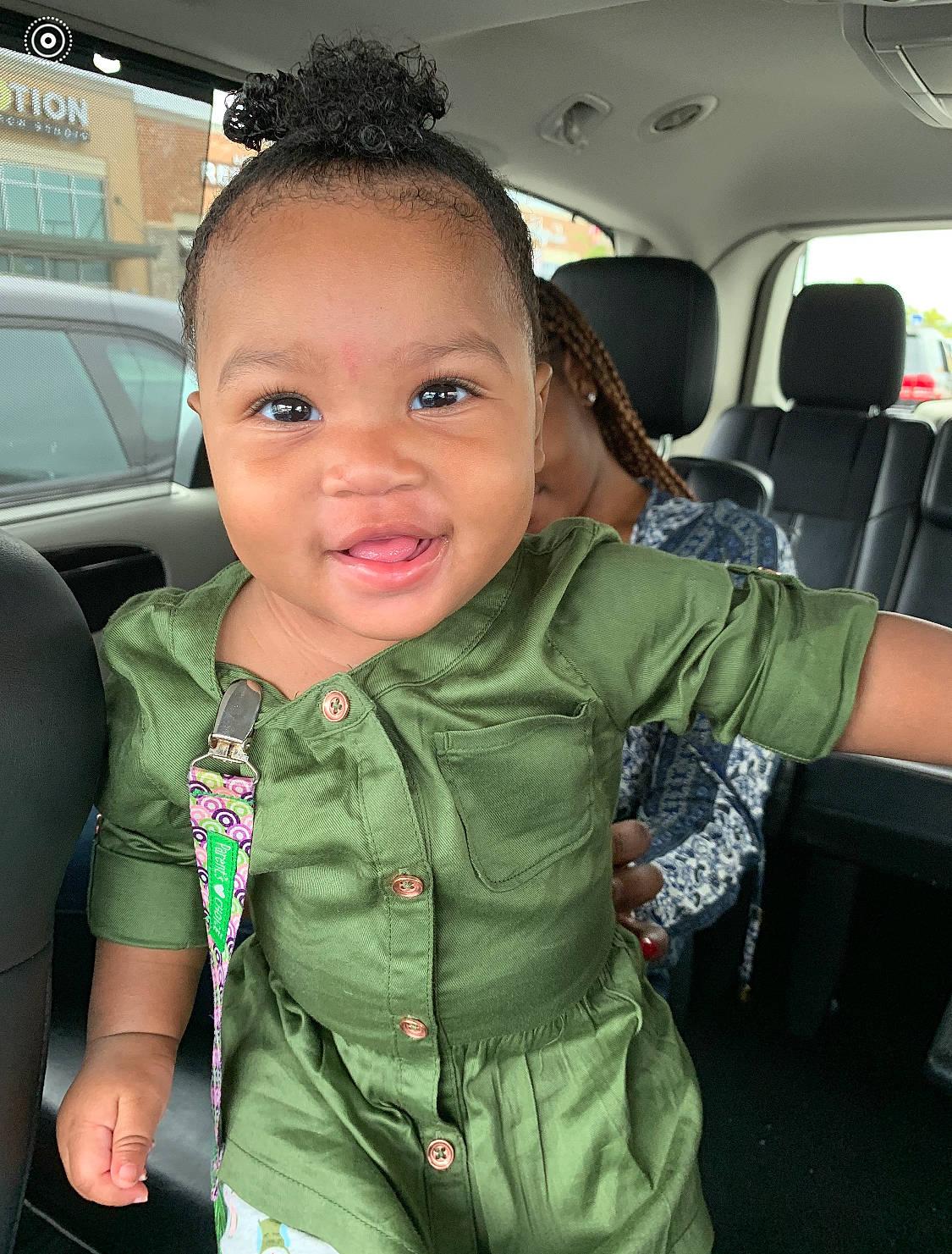 Avah is registered to the contest to win money with this photo: auto_part, automotive_exterior, baby_toddler_clothing, car_seat, cheek, chin, cool, eyebrow, forehead, fun, gesture, head_restraint, iris, motor_vehicle, person, skin, sleeve, smile, thumb, toddler