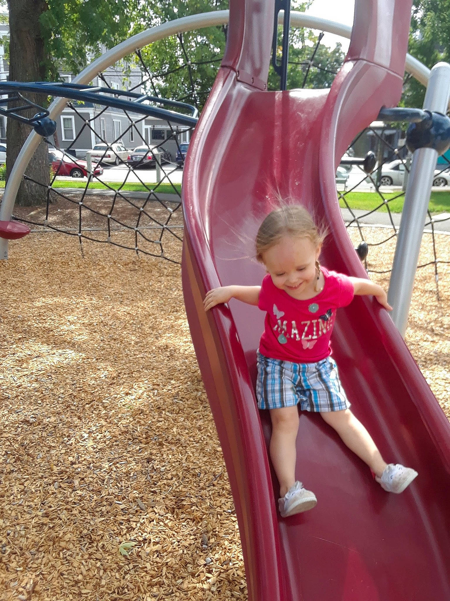 Avahlynn is registered to the contest to win money with this photo: child, chute, city, fun, human_settlement, joy, leisure, outdoor_play_equipment, person, pink, play, playground, playground_slide, public_space, recreation, toddler