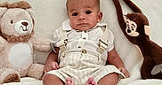 Alexander joined the competition — help win amazing prizes! baby, child, infant, plush_toy, lion_toy, monkey_toy, white_shirt, striped_shorts, suspenders, soft_blanket, cute, seated, indoors, portrait, smiling, feet, hands, face, comfortable, cozy