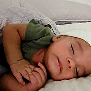 Alexander is registered to the contest to win money with this photo: baby, sleeping, blanket, bed, cap, infant, peaceful, cozy, child, soft, rest, pillow, toddler, cute, portrait, hands, face, relaxation, indoors, comfort