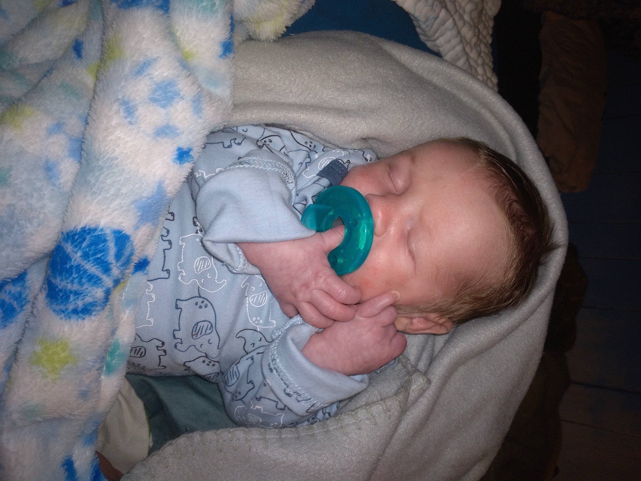 Damion is registered to the contest to win money with this photo: baby, baby_products, baby_toddler_clothing, bedtime, cheek, child, comfort, eye, face, hand, human_body, iris, linens, mouth, nap, person, room, skin, sleeve, toddler