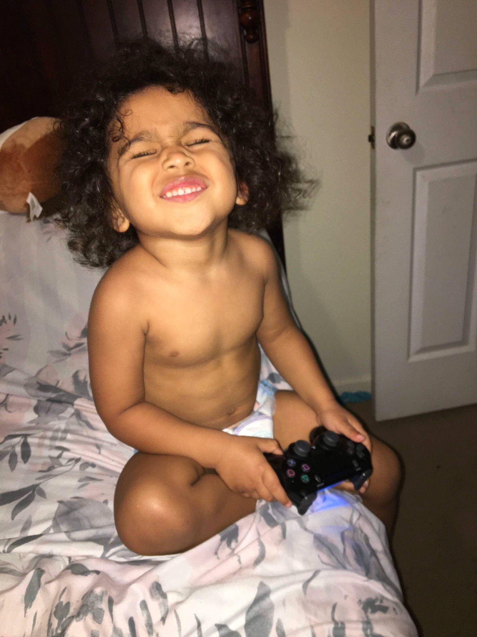 Javonni is registered to the contest to win money with this photo: abdomen, arm, black_hair, cheek, chest, child, joy, leg, muscle, person, sitting, skin, smile, stomach, thigh, toddler, trunk