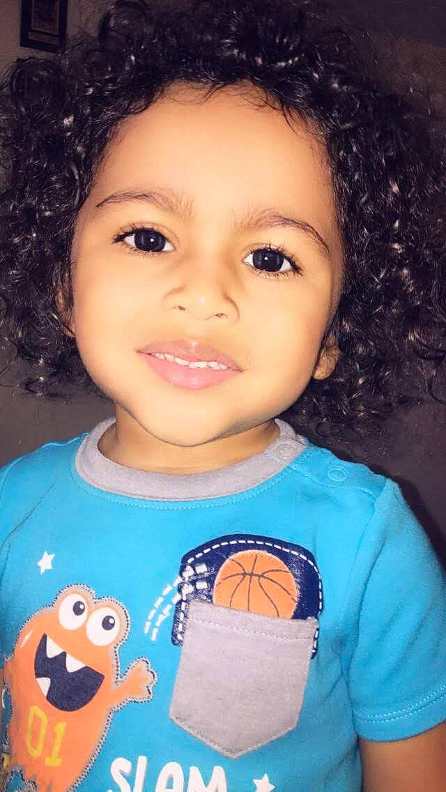 Javonni is registered to the contest to win money with this photo: black_hair, brown_hair, cheek, child, chin, eyebrow, face, forehead, hair, hairstyle, head, lip, nose, person, skin, smile, toddler, toy