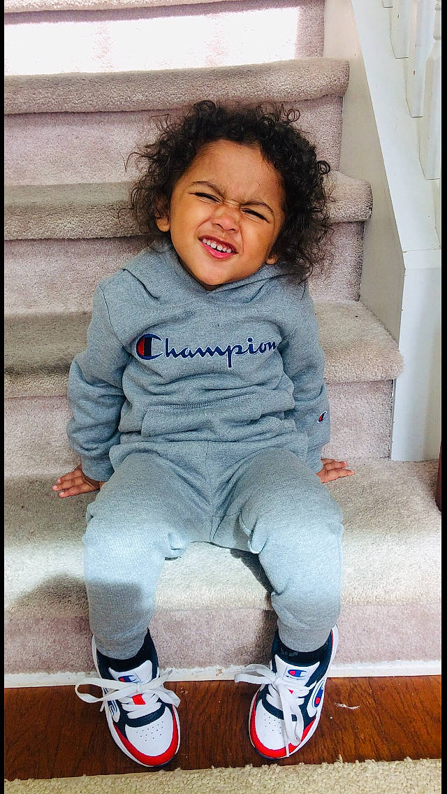 Javonni is registered to the contest to win money with this photo: anger, baby, baby_toddler_clothing, cheek, child, cool, facial_expression, footwear, leg, outerwear, person, shoe, smile, sportswear, t_shirt, toddler