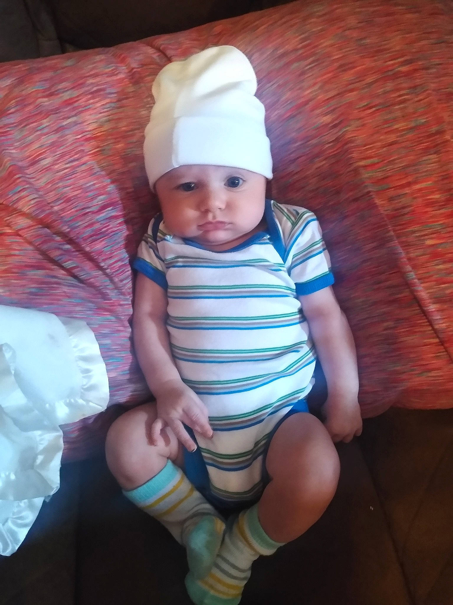 Zyad joined the competition — help win amazing prizes! baby, baby_toddler_clothing, cap, eye, face, finger, flash_photography, hand, hat, head, headwear, human_body, human_leg, knee, leg, neck, person, skin, sleeve, sock