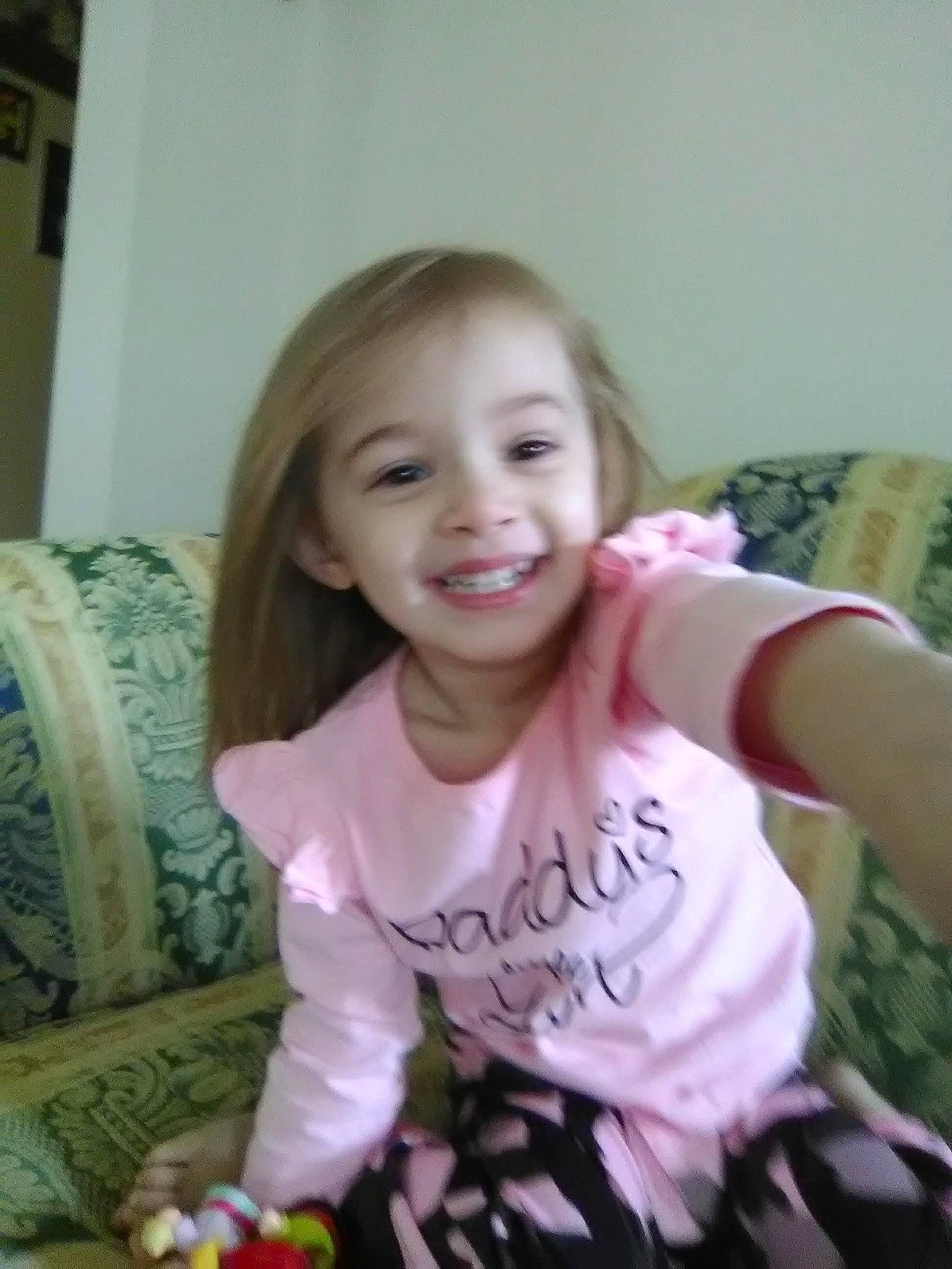 Laci joined the competition — help win amazing prizes! arm, baby_toddler_clothing, blond, chair, cheek, child, comfort, couch, event, eye, face, fun, furniture, happy, iris, joy, person, sitting, smile, t_shirt