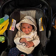 Everly joined the competition — help win amazing prizes! apparel, baby, car_seat, child, clothing, comfort, cozy, cute, fabric, happy, hoodie, indoor, infant, person, playful, seatbelt, sitting, small_hands, smile, toy