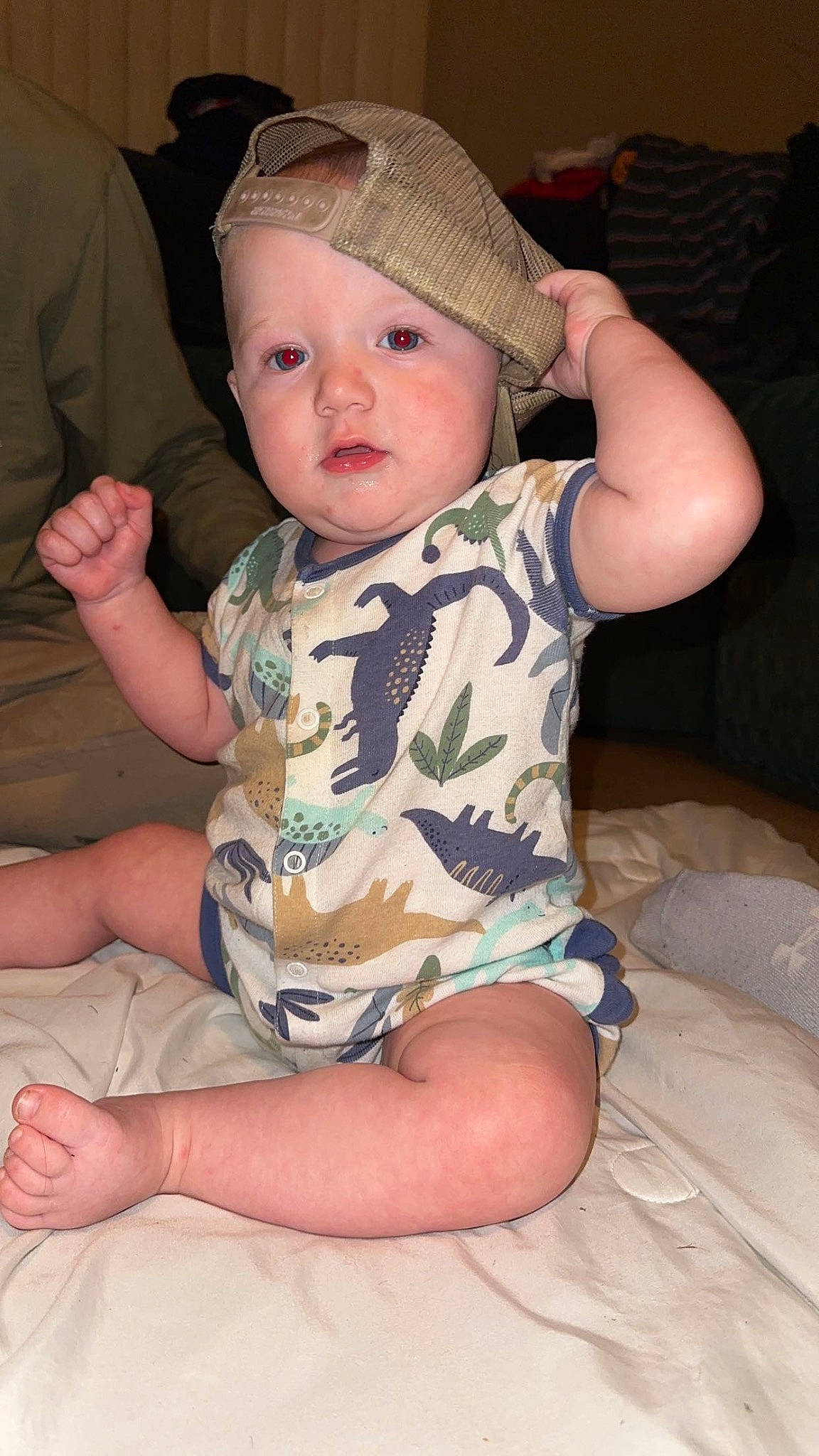 Braylon is registered to the contest to win money with this photo: baby, baby_toddler_clothing, cheek, chin, comfort, eye, face, facial_expression, finger, fun, hand, head, headwear, iris, leg, mouth, person, skin, sleeve, thigh