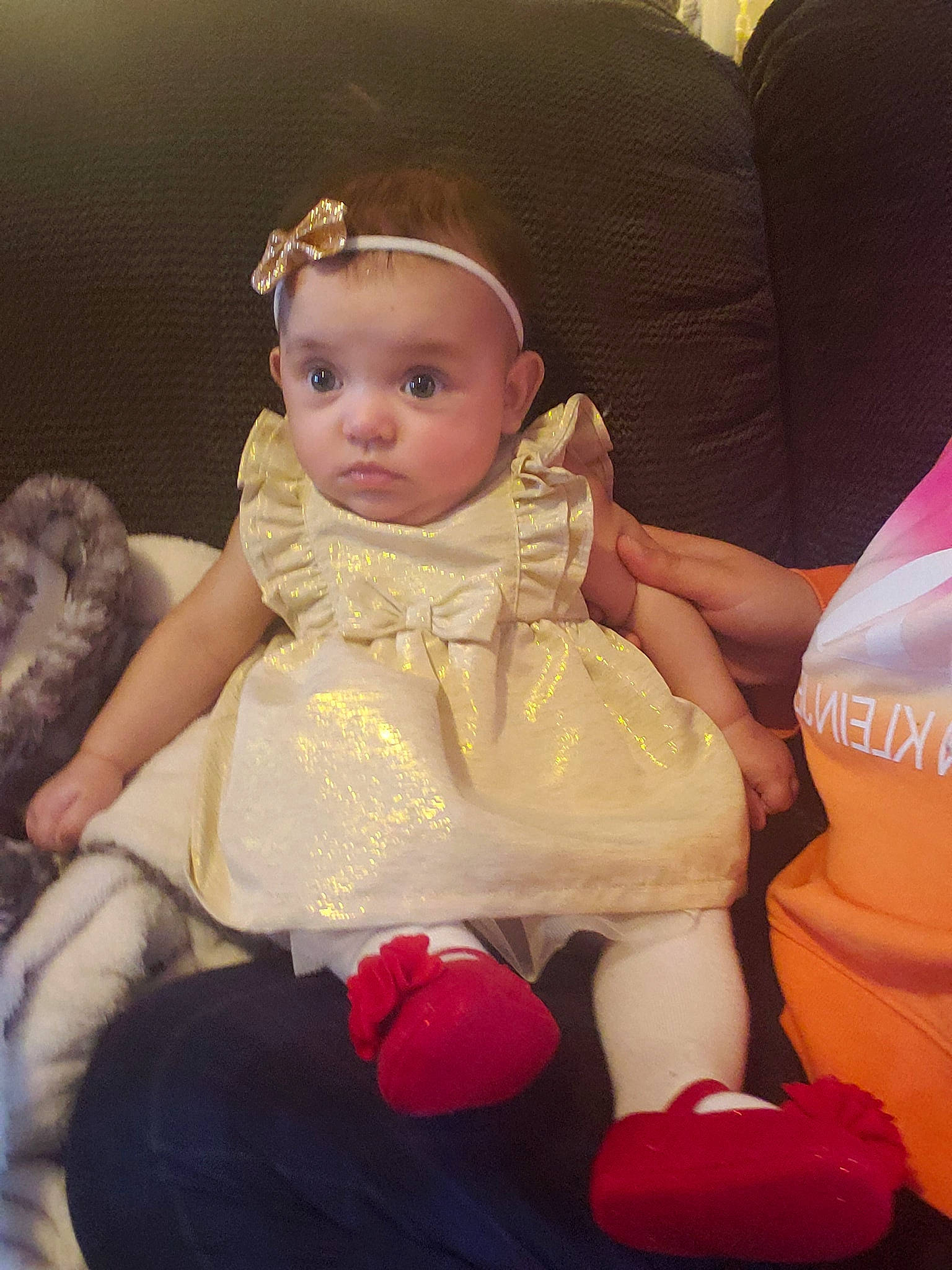 Belleadair is registered to the contest to win money with this photo: baby, baby_toddler_clothing, car_seat, car_seat_cover, child, dress, embellishment, fur, hair_accessory, head_restraint, headband, headpiece, person, sitting, sock, toddler